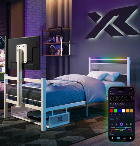 Modern bedroom with a bed, TV, and smartphone displaying a color control app.